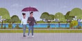 Lovers couple under umbrella man woman romantic walking in rain city urban park landscape background full length