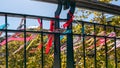 Lovers` Day, bridge over the river with coloured ribbons, symbol of love and friendship