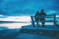 Lovers drink wine on the beach at sunset