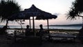 lovers enjoying the sunset at Sawarna beach, Banten, Indonesia