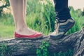 Lovers` feet on a tree branch