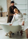 Lovers are fooling around. Everyday life. Morning hygiene. Relaxing time. Young adult body care morning routine. Morning