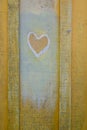 Lovers heart hand painted on wooden fisher hut wooden wall