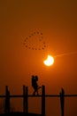 Lovers hugging on U Bein Bridge, Myanmar