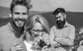 Lovers hugs outdoor flirt romance relations. Couple in love dating while jealous bearded man watching wife cheating him Royalty Free Stock Photo