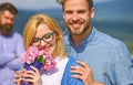 Lovers hugs outdoor flirt romance relations. Couple in love dating while jealous bearded man watching wife cheating him Royalty Free Stock Photo