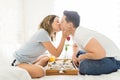 Lovers Kissing Over Breakfast Tray In Bedroom Royalty Free Stock Photo