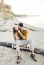 A lovers is kissing. Young couple is having fun and hugging on the beach. Beautiful girl embrace her boyfriend from back Royalty Free Stock Photo