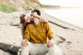 A lovers is kissing. Young couple is having fun and hugging on the beach. Beautiful girl embrace her boyfriend from back Royalty Free Stock Photo