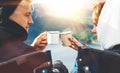 Lovers looking at each other, couple enjoy together of sun flare mountain, travelers drink tea on cup enjoy nature, romantic look