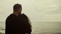 Lovers looking sea view on beach date. Couple hugging standing at water nature. Royalty Free Stock Photo