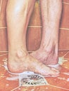 Lovers, man and woman barefoot in shower Royalty Free Stock Photo