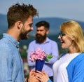 Lovers meeting outdoor flirt romance relations. Couple in love dating while jealous husband fixedly watching on Royalty Free Stock Photo