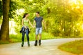 Lovers in nature on rollerblades Royalty Free Stock Photo