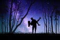 Lovers at night. Couple silhouette in forest. Milky Way at starry sky Royalty Free Stock Photo