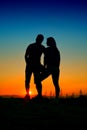 Lovers silhouette at sunset Royalty Free Stock Photo