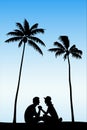 Lovers sitting on sand under palm trees Royalty Free Stock Photo