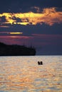 silhouettes in love romantic couple lovers hugging, sunset on the sea