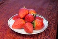 Lovers strawberries on a Wedgewood plate and red p