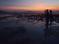 Lovers during Sunset Glow in Muddy Beach