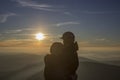 Lovers in sunset in mountains