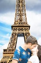 Lovers under the Eiffel Tower in Paris