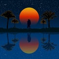 Lovers under palm trees. Silhouette of kissing couple on the beach under the palm tree on sunset background.