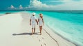 Lovers walk along the beach in the Maldives. Selective focus.