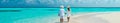 Lovers walk along the beach in the Maldives. Selective focus.