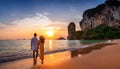 lovers walking on the beach with sunset Royalty Free Stock Photo