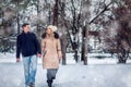 Lovers walking in winter snow- Smiling Couple in Winter Park having fun.. Royalty Free Stock Photo