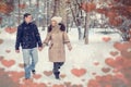 Lovers walking in winter snow- Smiling Couple in Winter Park valentines day Royalty Free Stock Photo