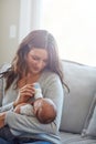 He loves his bottle. a mother feeding her newborn baby. Royalty Free Stock Photo