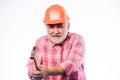 He loves his job. construction build. mature bearded man in hardhat. professional repairman in helmet. man builder use