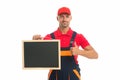 He loves his job. male worker in cap hold blackboard. board for copy space. builder service advertisement. best offer