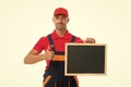 He loves his job. male worker in cap hold blackboard. board for copy space. builder service advertisement. best offer