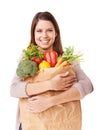 She loves shopping for vegetables. Portrait of an attractive young woman holding a bag of groceries. Royalty Free Stock Photo