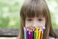 She loves to draw and color with crayons Royalty Free Stock Photo