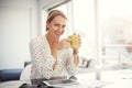 She loves to start her work day with coffee. a mature businesswoman working from her home office. Royalty Free Stock Photo