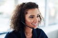 She loves working in this call center. High angle shot of an attractive young female call center agent working in her Royalty Free Stock Photo