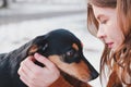 Loving and adoring dogs: woman with her puppy. Royalty Free Stock Photo