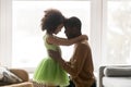 Loving African American father and preschool daughter touching foreheads Royalty Free Stock Photo