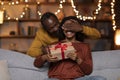 Loving african american man making birthday surprise for wife Royalty Free Stock Photo