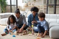 Loving African American parents and kids playing with construction toys Royalty Free Stock Photo