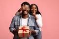 Loving african american woman making surprise for her man Royalty Free Stock Photo