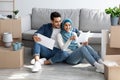 Loving arab family working on design for new apartment