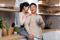 Loving asian couple enjoying morning coffee at home Royalty Free Stock Photo