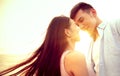Loving asian young couple kissing at sunset. Valentine`s day