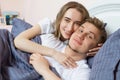 Loving beautiful couple in bed in the morning, loving family - heterosexual couple