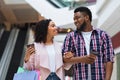 Loving black couple shopping at the mall and drinking takeaway coffee Royalty Free Stock Photo